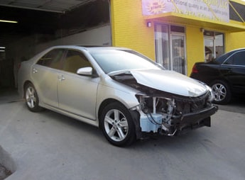 silver toyota car damaged, needing repair work performed at San Antonio body shop | Star Collision Repair Auto Shop San Antonio