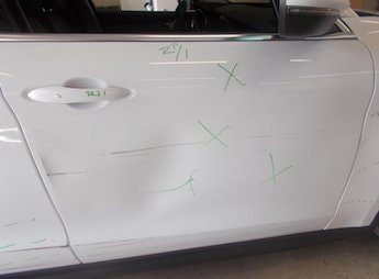 white suv with marks on it to show damage | Star Collision Repair Auto Shop San Antonio